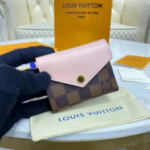 Zipped co Louis Vuitton Damier Ebene Zoe Wallet Pink